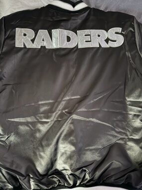 Black Raiders Satin Bomber Jacket with Silver Lettering women’s size large